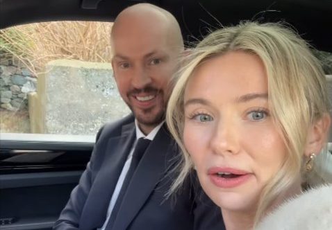 Georgia Toffolo and James Watt sitting in a car.