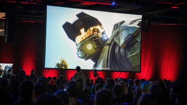 A shot of Master Chief from Halo on a large screen in an event hall