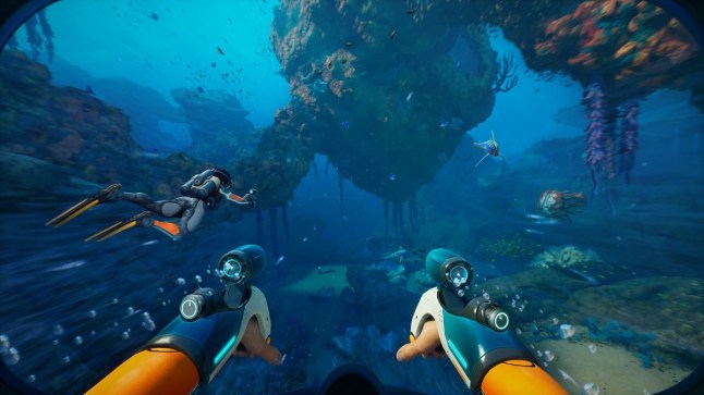 Subnautica 2 first person gameplay of a diver swimming underwater while another diver swims ahead